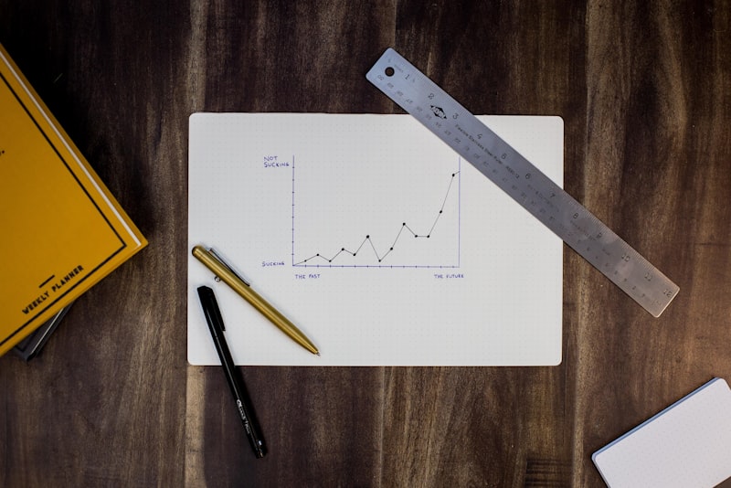 A person standing at a whiteboard mapping out plans during a small business planning session.